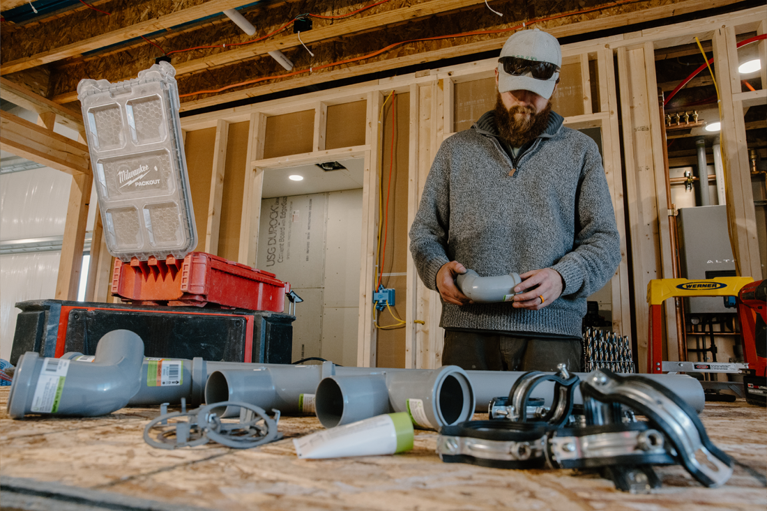 contractor with hat holding innoflue